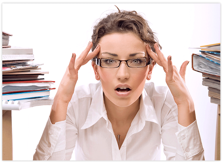 woman with glasses being stressed at work